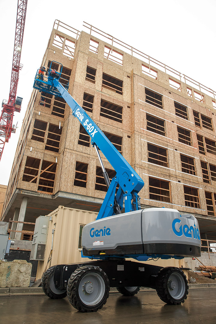 Genie boom lift in action with bldg Boom lift